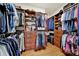 Spacious walk-in closet with wood shelving and drawers provides ample storage for clothing and accessories at 2018 Links View Dr, Fort Mill, SC 29707