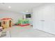 A carpeted bonus room features a playhouse and a bouncy house for children at 2175 Autumn Cyprus Ave, Gastonia, NC 28054