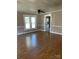 Inviting living room features hardwood floors, neutral paint, and abundant natural light at 222 2Nd Ave, Albemarle, NC 28001