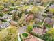 Aerial view of a neighborhood, showcasing the homes and lush green landscaping in a suburban setting at 2411 Calais Pl, Charlotte, NC 28211