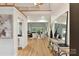 Open-concept foyer with wood floors leading to a living room, enhancing the home's spacious feel at 2411 Calais Pl, Charlotte, NC 28211