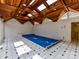 Stunning indoor pool area with a unique wood ceiling and skylights at 2411 Calais Pl, Charlotte, NC 28211
