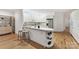 Modern kitchen featuring white cabinets, stainless steel appliances, and a functional island at 2411 Calais Pl, Charlotte, NC 28211