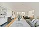 Inviting living room with a fireplace, built-in shelving and open concept layout, and hardwood floors at 2411 Calais Pl, Charlotte, NC 28211
