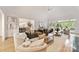 Bright living room with large windows and open layout into a dining room, great for entertaining at 2411 Calais Pl, Charlotte, NC 28211
