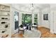 Cozy sitting area features a large bay window with views of the landscaped yard at 2411 Calais Pl, Charlotte, NC 28211