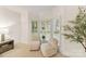 Charming sitting area with a bay window and comfortable seating; flooded with natural light at 2411 Calais Pl, Charlotte, NC 28211
