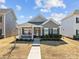 Charming single-story home with a welcoming front porch and well-maintained landscaping at 250 Kerri Dawn Ln, Locust, NC 28097