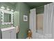 Bathroom showcasing vanity, tub with shower and neutral color scheme at 2500 Cranbrook Ln # 2, Charlotte, NC 28207