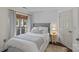 Bedroom featuring a plush bed, neutral decor, and natural light from the window at 2500 Cranbrook Ln # 2, Charlotte, NC 28207