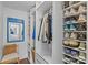 Walk-in closet with built-in shelving and shoe storage for organized living at 2500 Cranbrook Ln # 2, Charlotte, NC 28207