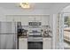 Updated kitchen featuring stainless steel appliances and subway tile backsplash at 2500 Cranbrook Ln # 2, Charlotte, NC 28207