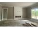 Bright living area featuring a custom shiplap fireplace and a large window at 2720 Old Course Rd, Monroe, NC 28112