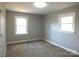 Bedroom offers carpet flooring, a closet, and two large windows for natural light at 2739 Great Falls Hwy, Lancaster, SC 29720