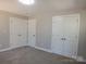 Bedroom featuring two closets and neutral carpeting and wall color at 2739 Great Falls Hwy, Lancaster, SC 29720