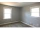 Bedroom featuring two windows and neutral carpeting and wall color at 2739 Great Falls Hwy, Lancaster, SC 29720