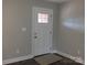 Hallway features dark laminate flooring and a white door with a window at 2739 Great Falls Hwy, Lancaster, SC 29720