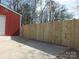 Property featuring wood fence, detached garage, and concrete driveway at 2739 Great Falls Hwy, Lancaster, SC 29720