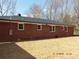 Brick home exterior, showcasing back facade with windows and new yard at 2739 Great Falls Hwy, Lancaster, SC 29720