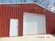 Exterior view of detached garage with red siding and a roll-up door at 2739 Great Falls Hwy, Lancaster, SC 29720