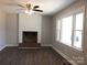 Inviting living room features a fireplace, wood floors, and large windows at 2739 Great Falls Hwy, Lancaster, SC 29720