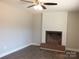 Cozy living room with hardwood flooring and fireplace with white shiplap above at 2739 Great Falls Hwy, Lancaster, SC 29720