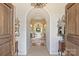 Grand foyer with tile floors, arched doorways, mirrors, and a clear view into the formal living area at 318 S Canterbury Rd, Charlotte, NC 28211