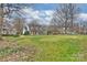 Expansive front lawn showcasing the neighborhood, mature trees, and well-maintained landscaping at 318 S Canterbury Rd, Charlotte, NC 28211