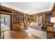 Wood-paneled library featuring custom bookshelves and comfortable seating at 318 S Canterbury Rd, Charlotte, NC 28211