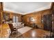 Elegant wood-paneled library with built-in bookshelves and comfortable seating at 318 S Canterbury Rd, Charlotte, NC 28211