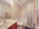 Bathroom boasts a shower-tub combo, vanity, and ample lighting at 3253 Ian Patrick Ave, Kannapolis, NC 28083