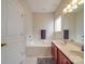 Bright bathroom with double sink vanity, large soaking tub, and tile flooring at 3253 Ian Patrick Ave, Kannapolis, NC 28083