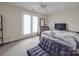 This bedroom features neutral walls, carpet, a ceiling fan, and a convenient door to the outside at 3253 Ian Patrick Ave, Kannapolis, NC 28083