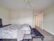 A spacious bedroom with natural light, neutral carpet, and a connecting doorway to other rooms at 3253 Ian Patrick Ave, Kannapolis, NC 28083