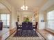 Elegant dining area features a stylish chandelier, table setting, and large mirror at 3253 Ian Patrick Ave, Kannapolis, NC 28083