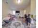 A spacious living room featuring tile floors, recessed lights, and a large window for natural light at 3253 Ian Patrick Ave, Kannapolis, NC 28083