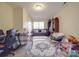 Living room with cozy seating area, decorative rug, and lots of natural light at 3253 Ian Patrick Ave, Kannapolis, NC 28083