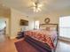 Bright main bedroom with hardwood floors, large bed, and natural lighting at 3253 Ian Patrick Ave, Kannapolis, NC 28083