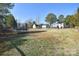 Expansive backyard with trampoline and playground, ideal for outdoor activities at 345 Corinth Church Rd, Mooresville, NC 28115