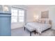 Cozy bedroom featuring a patterned bed, bench, window, and an accent cabinet at 345 Corinth Church Rd, Mooresville, NC 28115