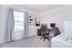 Bright bedroom featuring a work space, large window, and neutral decor at 345 Corinth Church Rd, Mooresville, NC 28115