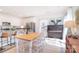 Bright and open dining area next to kitchen features a piano, natural light, and modern design at 345 Corinth Church Rd, Mooresville, NC 28115