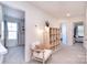 Bright hallway features an accent chair, shelving, and access to bedrooms at 345 Corinth Church Rd, Mooresville, NC 28115