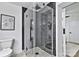 The elegant shower features black accents, clear glass doors, and mosaic tile flooring at 356 Hill Rd, Lincolnton, NC 28092