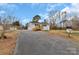 Exterior view of a charming white brick home with a long driveway at 356 Hill Rd, Lincolnton, NC 28092