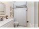 Bathroom featuring a white vanity, decorative mirror and shower with curtain at 3601 Rosedown Dr, Matthews, NC 28105