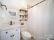 Bathroom featuring a white vanity, decorative mirror, and shower with a white curtain at 3601 Rosedown Dr, Matthews, NC 28105