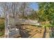 Outdoor fire pit area with wooden bench seating at 3601 Rosedown Dr, Matthews, NC 28105