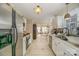 Open kitchen featuring stainless steel appliances and views into the dining area at 3601 Rosedown Dr, Matthews, NC 28105