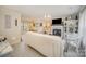 Inviting living room featuring a fireplace, white furniture, a view into the dining area, and modern decor at 3601 Rosedown Dr, Matthews, NC 28105